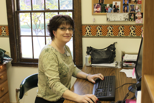 Vet sitting on computer portrait